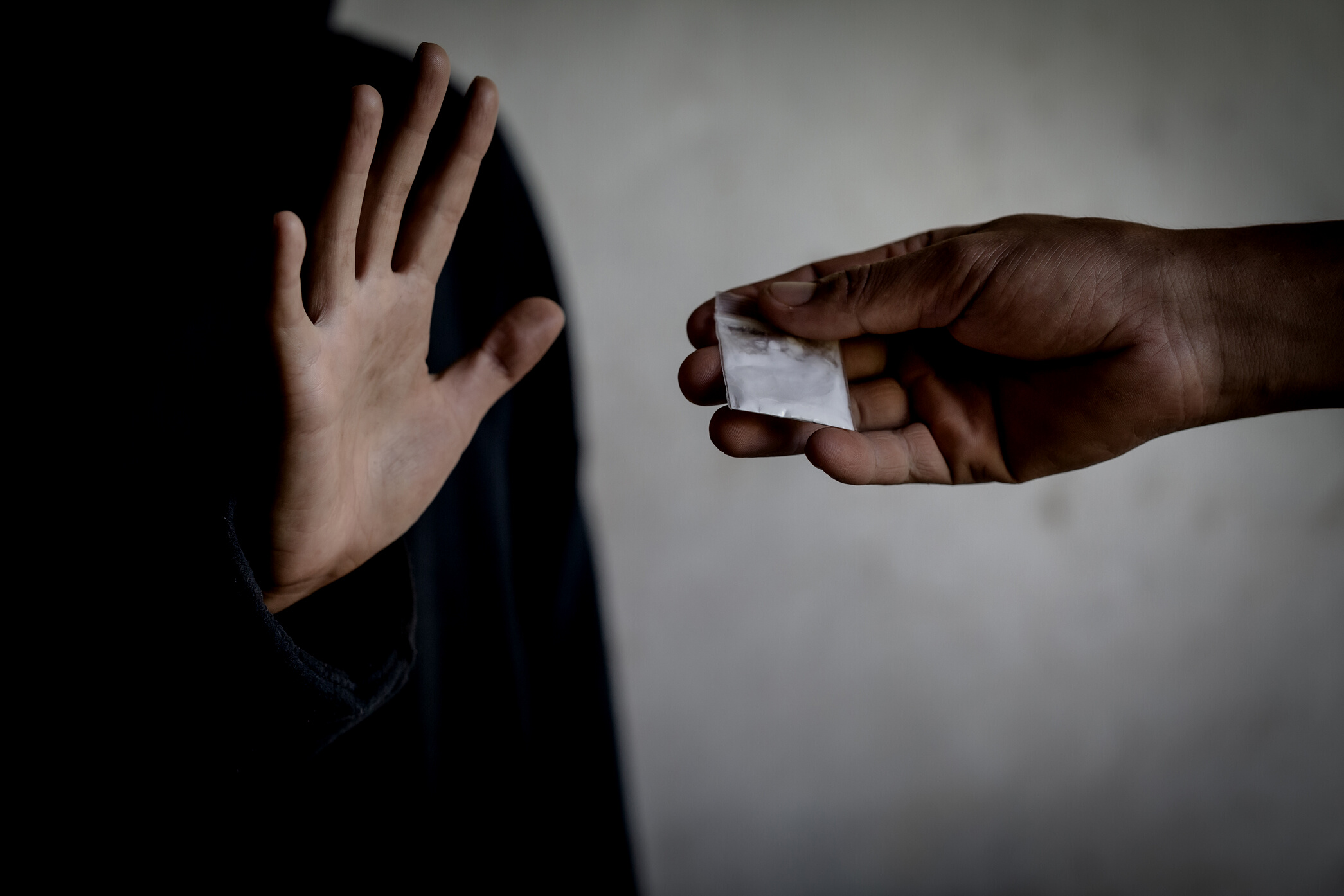 A woman making a stop gesture to drugs, Stop drugs concept. International Day against Drug Abuse.